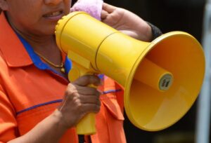 a woman with a yellow siren
