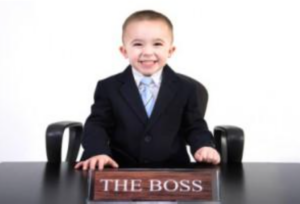 photo of a kid dressed as a boss