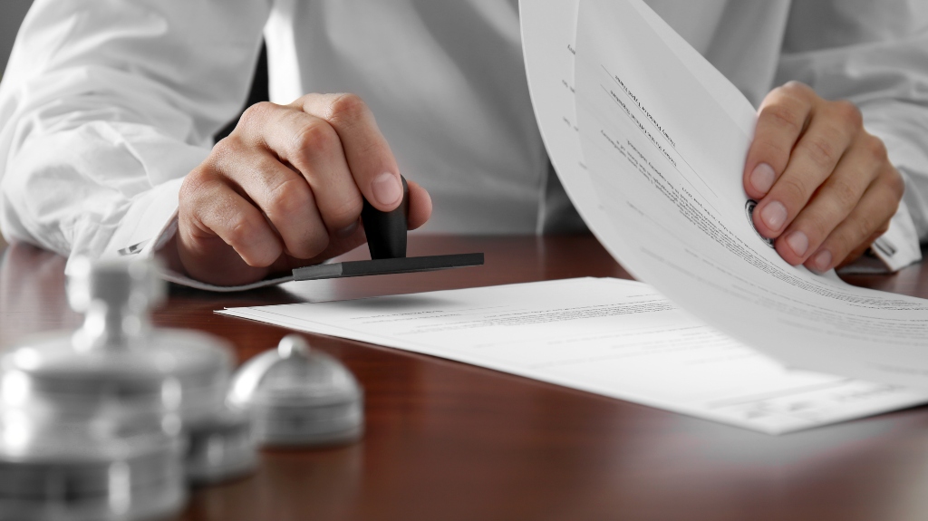 lawyer put the stamp on the document
