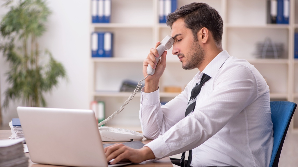 stressed male employee after phone call