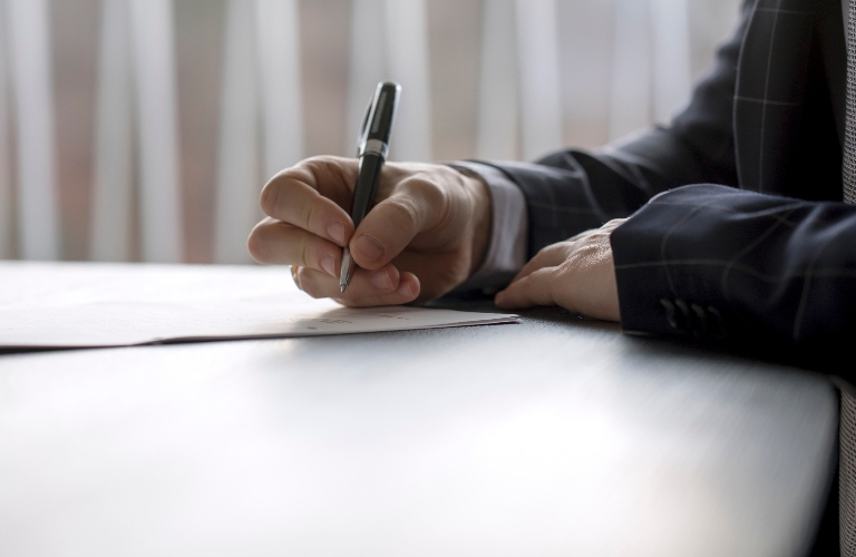 Man signing a document