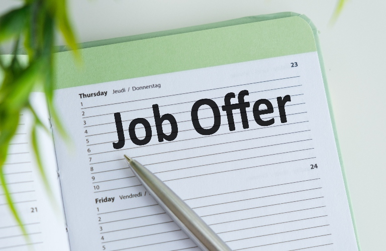job offer written in a notebook